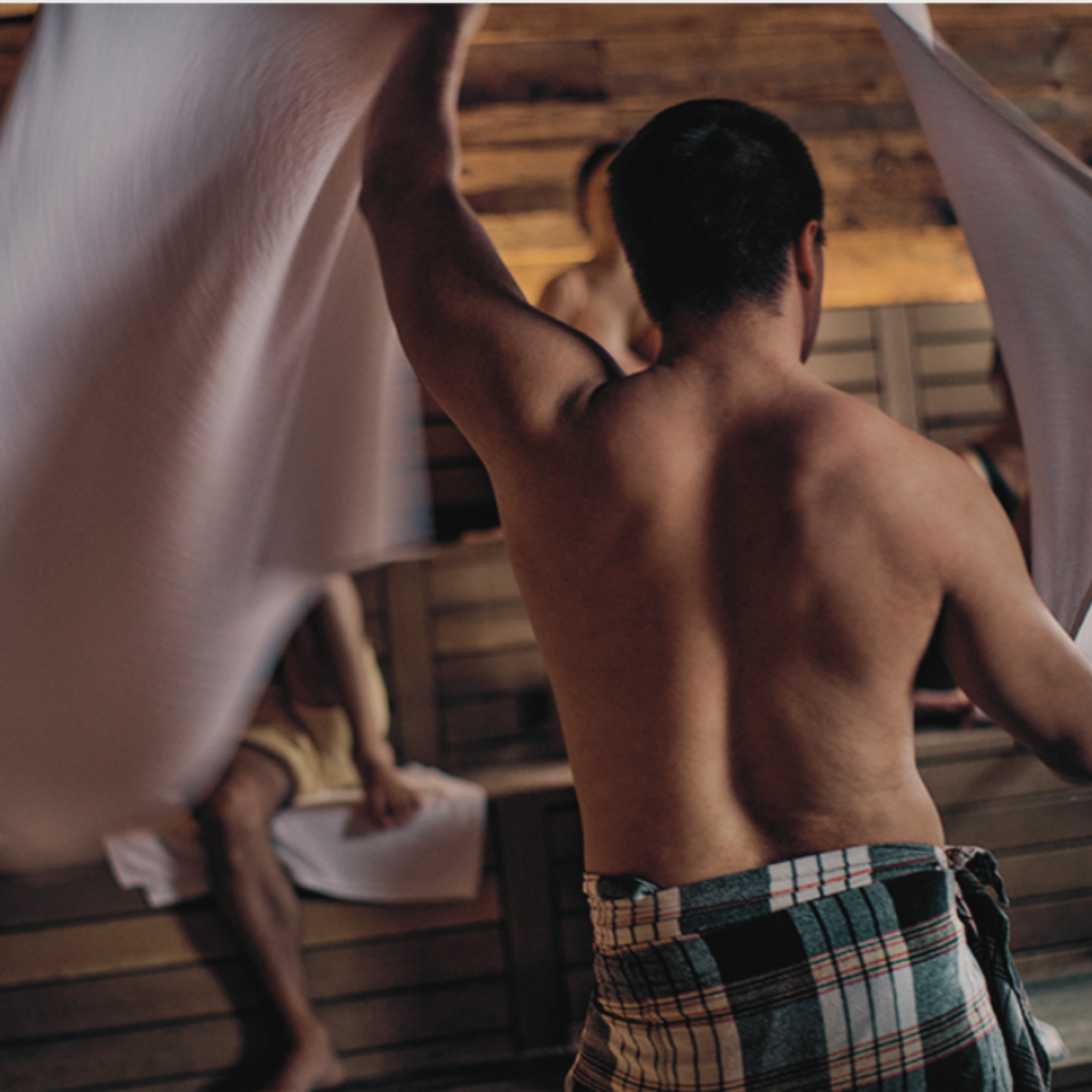 Aufguss is a sauna session where a sauna master pours water on the hot stones, creating steam that fills the sauna